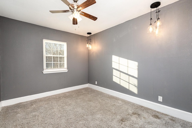 carpeted empty room with ceiling fan