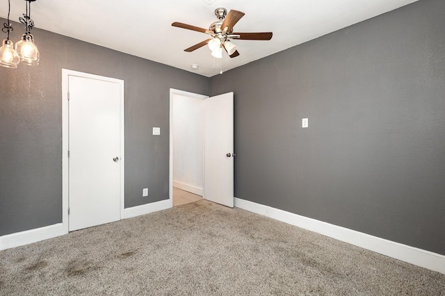 unfurnished bedroom with light carpet and ceiling fan