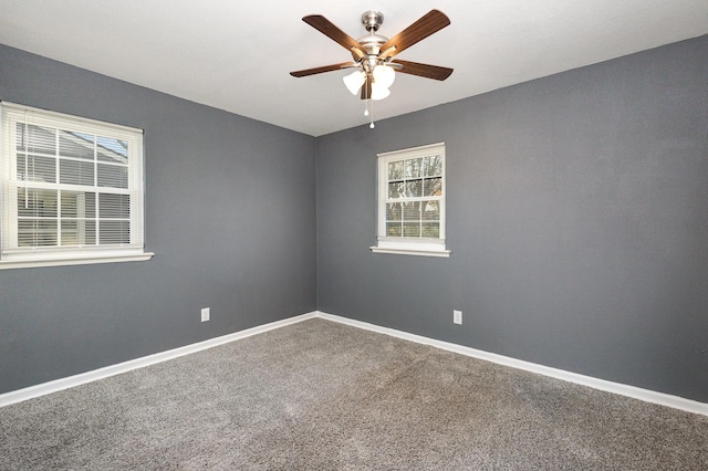 unfurnished room with carpet and ceiling fan