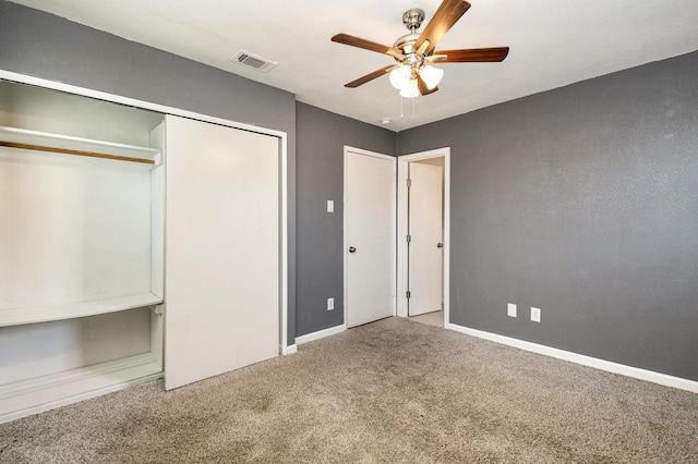 unfurnished bedroom featuring ceiling fan and carpet flooring