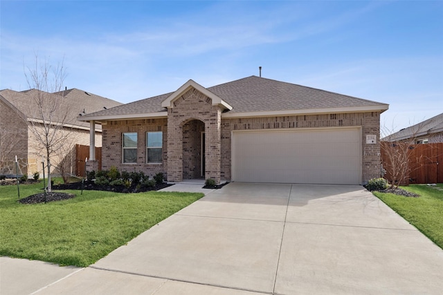 single story home with a front yard and a garage