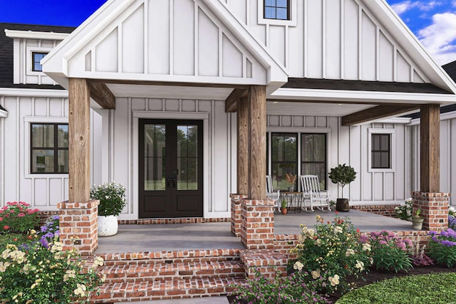 entrance to property featuring french doors and covered porch