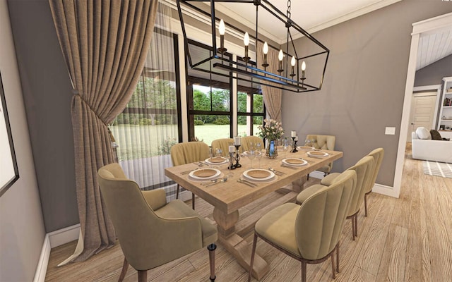 dining area with ornamental molding, an inviting chandelier, and light hardwood / wood-style flooring