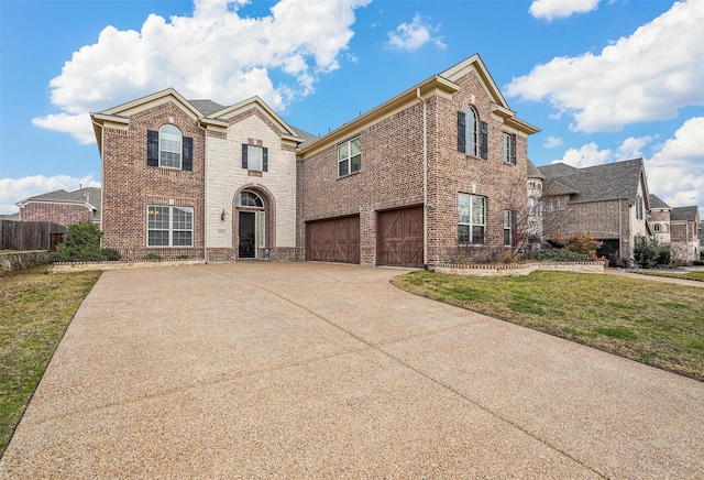 view of front of home featuring a garage and a front yard