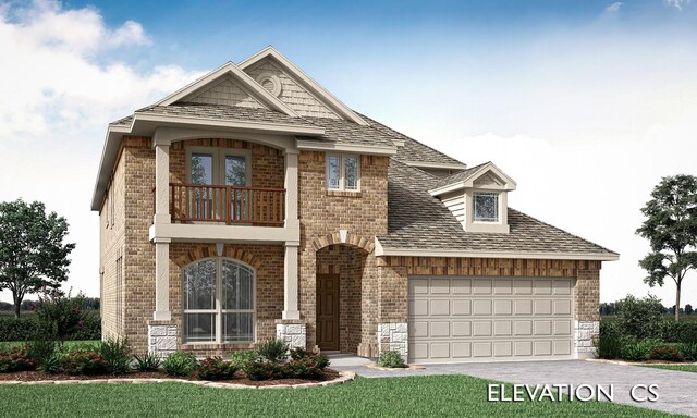 view of front of home featuring a balcony and a garage