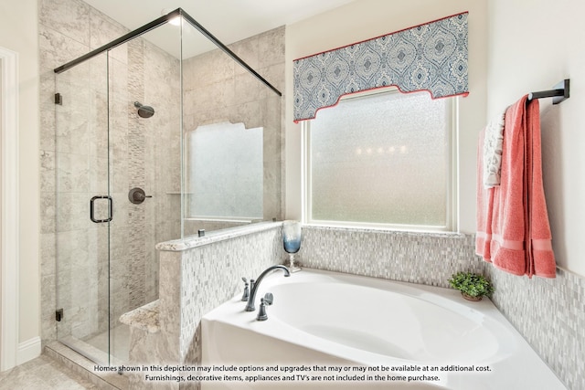 bathroom featuring shower with separate bathtub