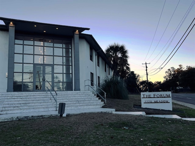 view of property exterior at dusk