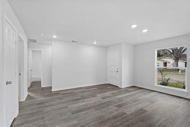 empty room featuring hardwood / wood-style flooring