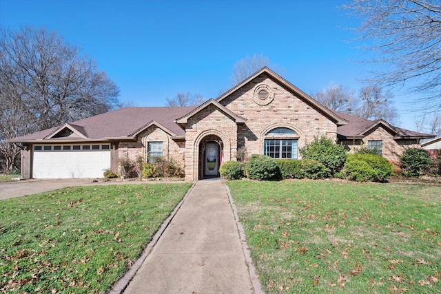 view of front of property featuring a garage and a front lawn