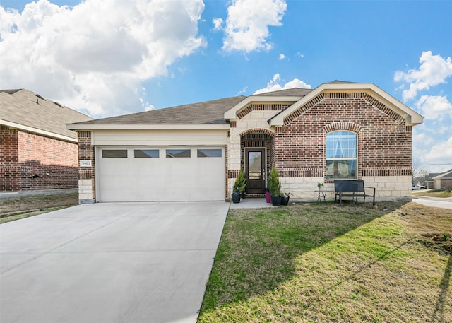 view of front of home with a front yard and a garage