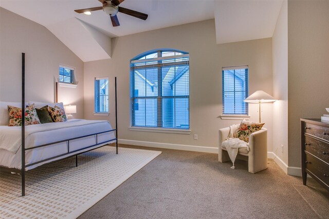 carpeted bedroom featuring ceiling fan and vaulted ceiling