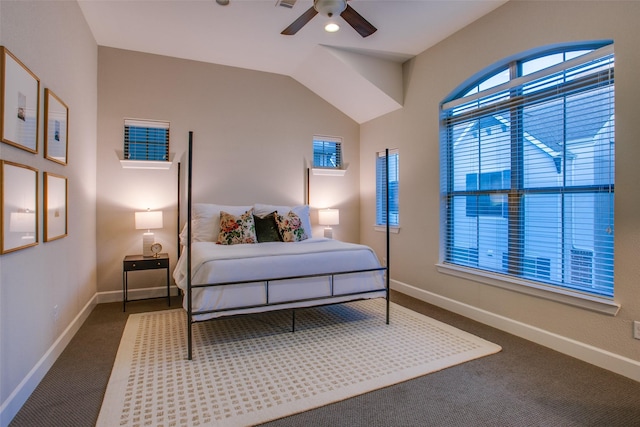 carpeted bedroom with ceiling fan and vaulted ceiling