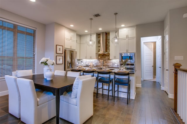 dining space featuring dark hardwood / wood-style floors