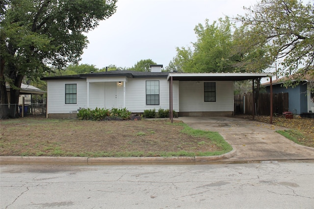 view of front of home with a carport