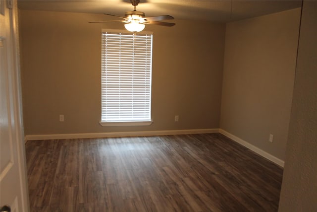 unfurnished room featuring ceiling fan and dark hardwood / wood-style flooring