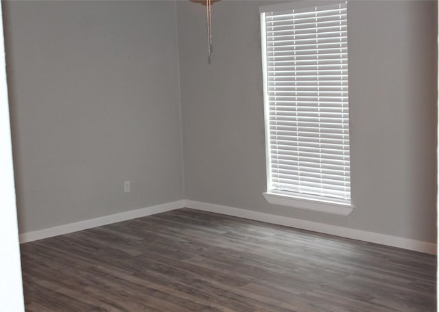 empty room featuring dark hardwood / wood-style flooring