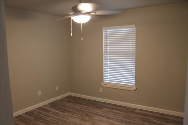 spare room featuring ceiling fan and dark hardwood / wood-style flooring