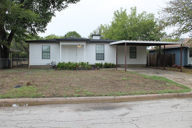 view of front of property featuring a carport