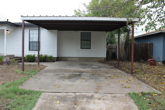 view of front of property with a carport