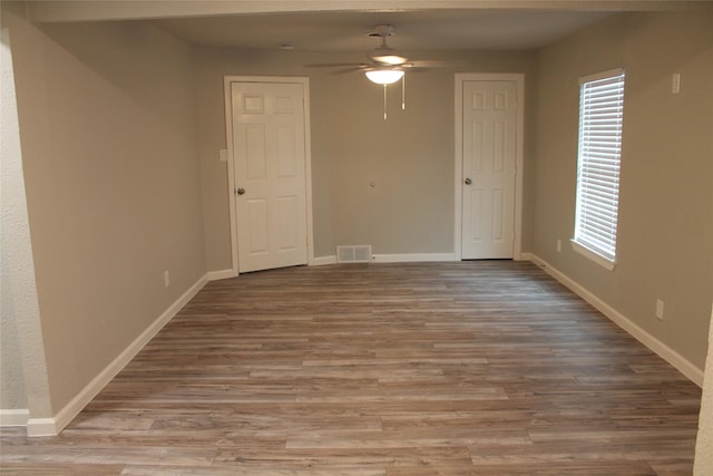 unfurnished room with light hardwood / wood-style floors and ceiling fan