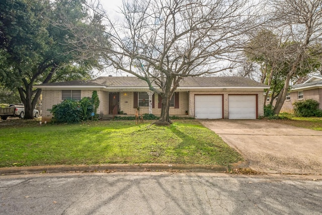 single story home featuring a garage and a front yard