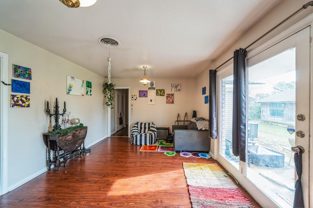 dining room with wood-type flooring