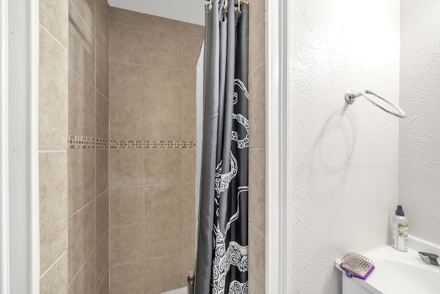 bathroom featuring curtained shower