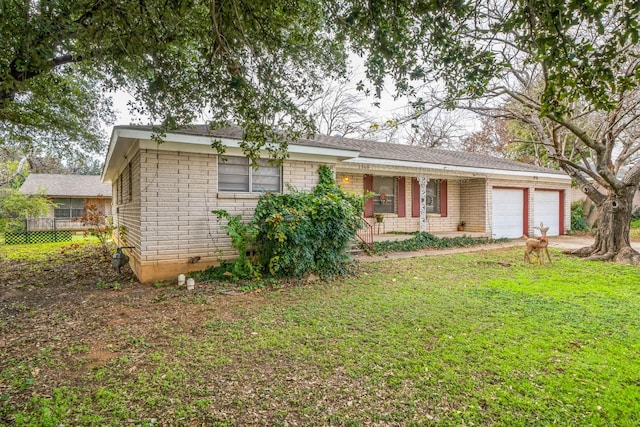 single story home with a garage, a front yard, and covered porch