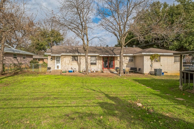 rear view of house with a lawn