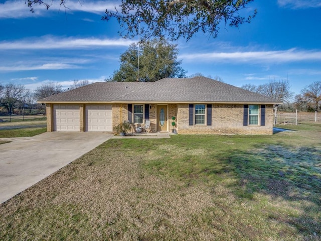 single story home featuring a garage and a front lawn