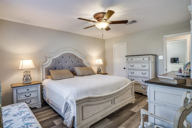 bedroom with ceiling fan and dark hardwood / wood-style flooring