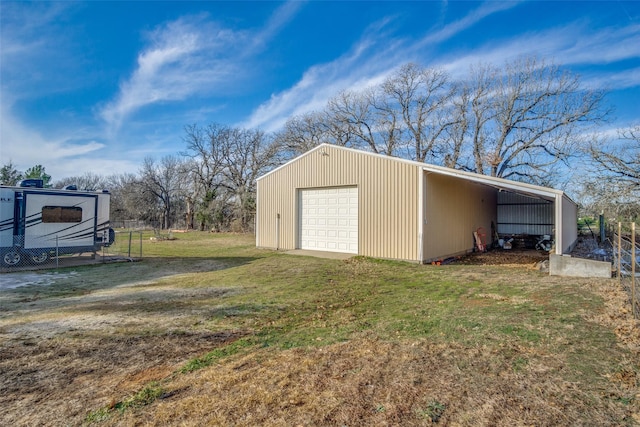 view of outdoor structure featuring a lawn and a garage