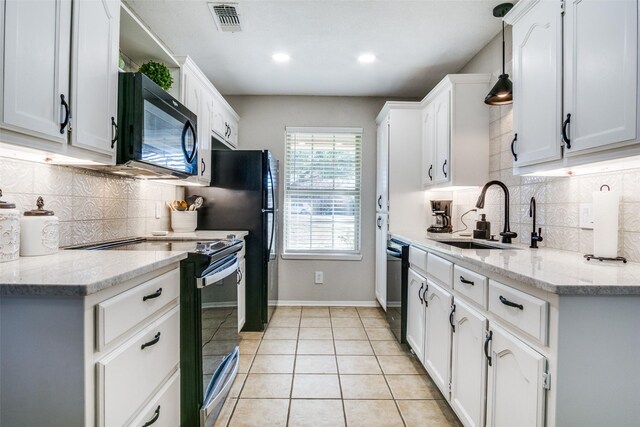 kitchen with sink, white cabinetry, black appliances, and hanging light fixtures