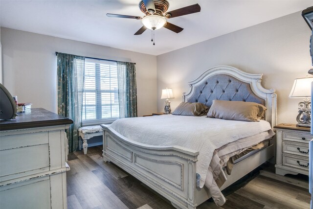 bedroom featuring ceiling fan and dark hardwood / wood-style floors