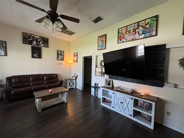 living room featuring wood-type flooring and ceiling fan