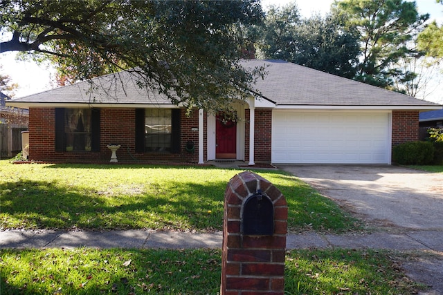 ranch-style home featuring a garage and a front lawn