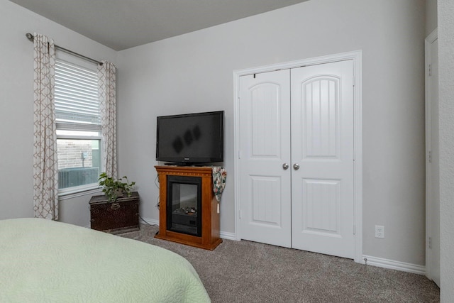 carpeted bedroom featuring a closet