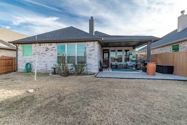 back of house featuring a patio area