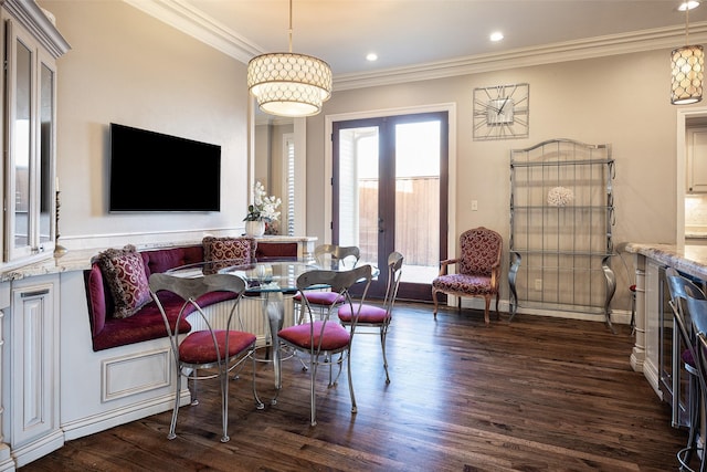 sitting room with dark hardwood / wood-style flooring, french doors, and ornamental molding