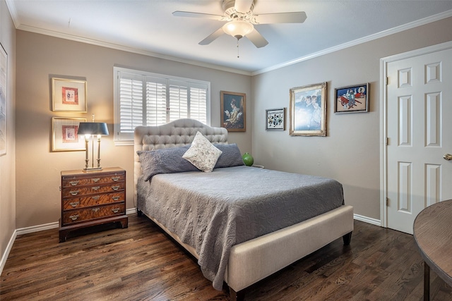 bedroom featuring dark hardwood / wood-style flooring, ceiling fan, and crown molding