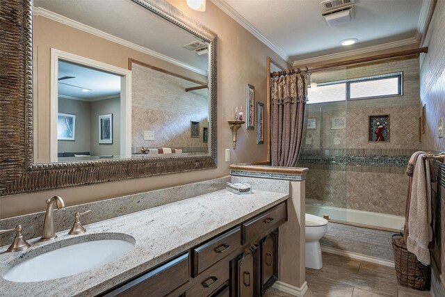 full bathroom featuring ornamental molding, vanity, toilet, and shower / bath combo with shower curtain