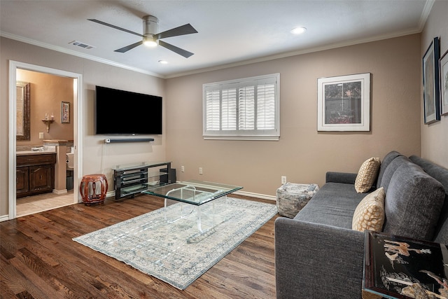 living room featuring ceiling fan, wood-type flooring, and ornamental molding