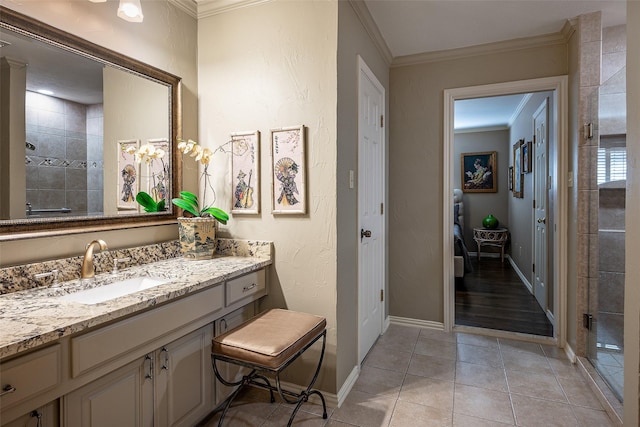 bathroom featuring tile patterned flooring, vanity, an enclosed shower, and crown molding