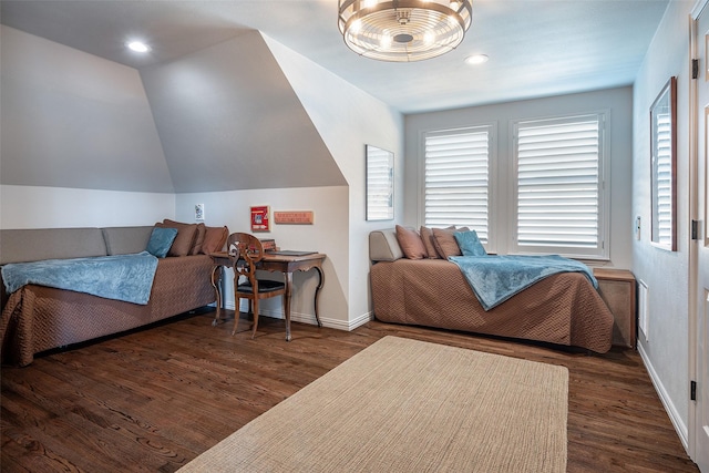 bedroom featuring dark hardwood / wood-style flooring and lofted ceiling