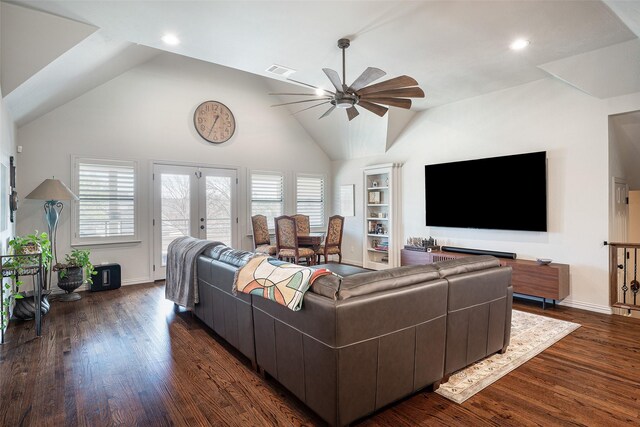 living room with dark hardwood / wood-style flooring, a wealth of natural light, and ceiling fan