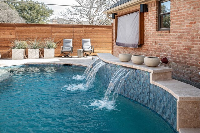 view of pool featuring pool water feature