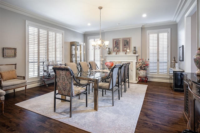 dining room featuring dark hardwood / wood-style floors, crown molding, and a notable chandelier