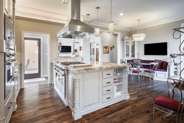 kitchen featuring white cabinetry, island range hood, pendant lighting, and double oven range