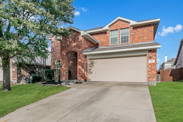 view of front of property featuring a front yard and a garage