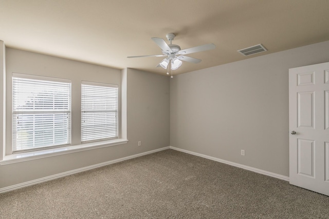 unfurnished room featuring ceiling fan and carpet flooring